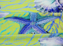 limonkowa dzianina w niebieskie morskie motywy - koralowce, muszle, rozgwiazdy